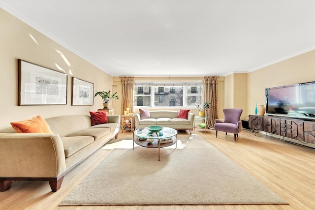 living area with wood finished floors and ornamental molding