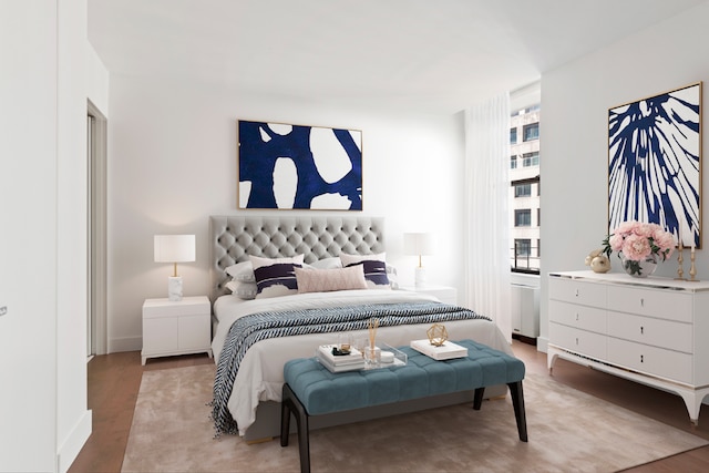 bedroom with wood-type flooring