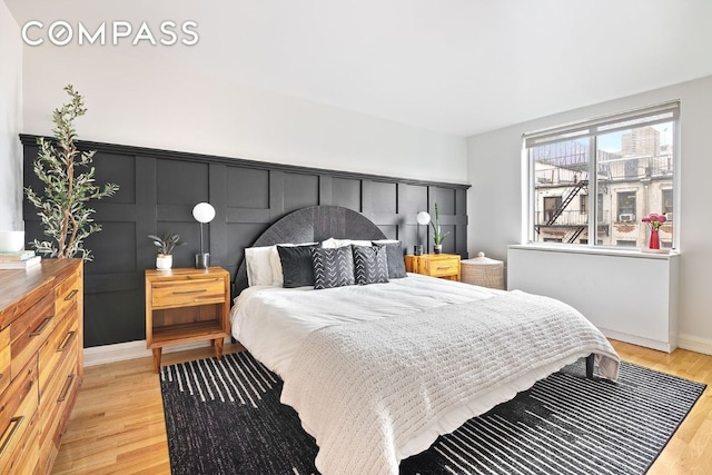 bedroom with light hardwood / wood-style floors