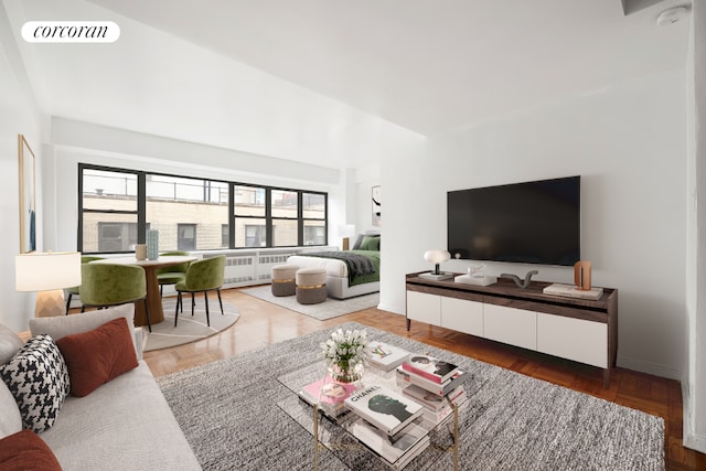 living room with radiator and parquet floors