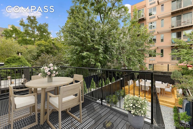 balcony featuring outdoor dining space