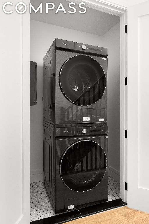 laundry room featuring stacked washer / dryer