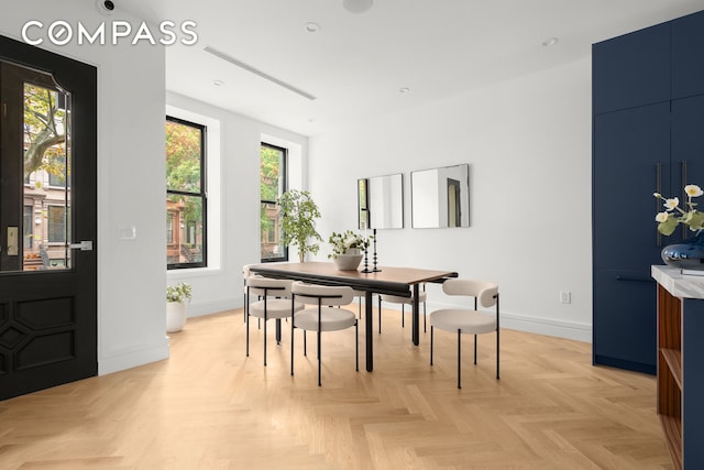 dining room with recessed lighting and baseboards