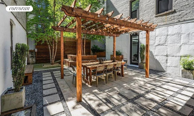 view of patio / terrace with fence, a pergola, and outdoor dining space