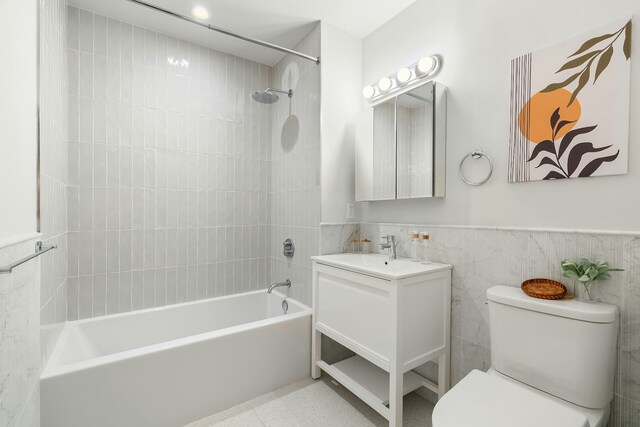 463 W 142nd St Phb, Phb, New York City, NY 10031 - bathroom featuring toilet,  shower combination, vanity, wainscoting, and tile walls