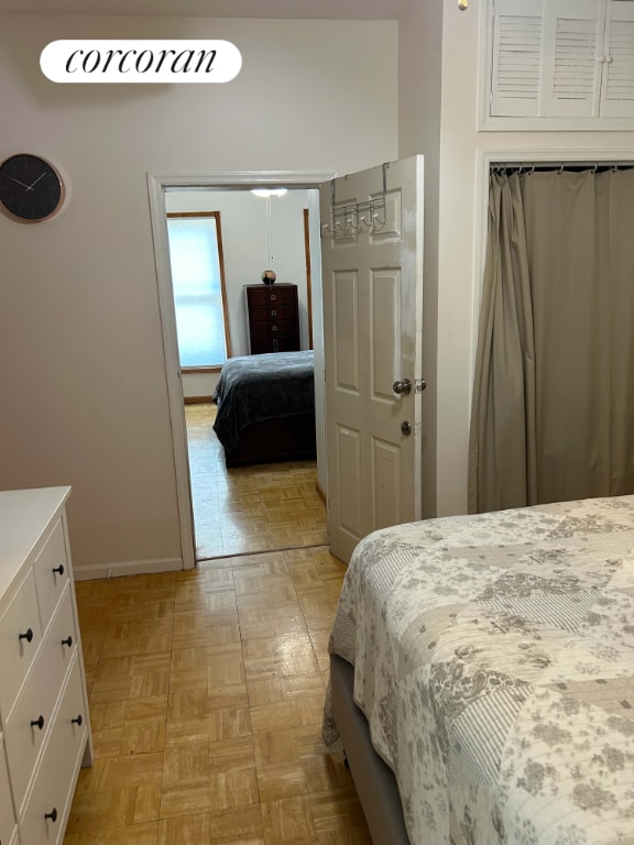 bedroom featuring light parquet flooring