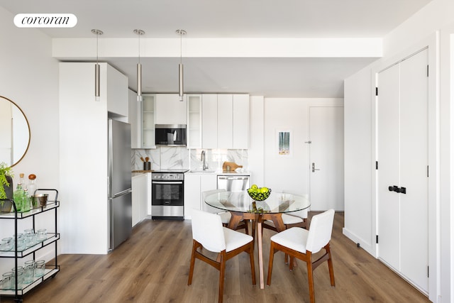 dining space featuring dark wood-type flooring