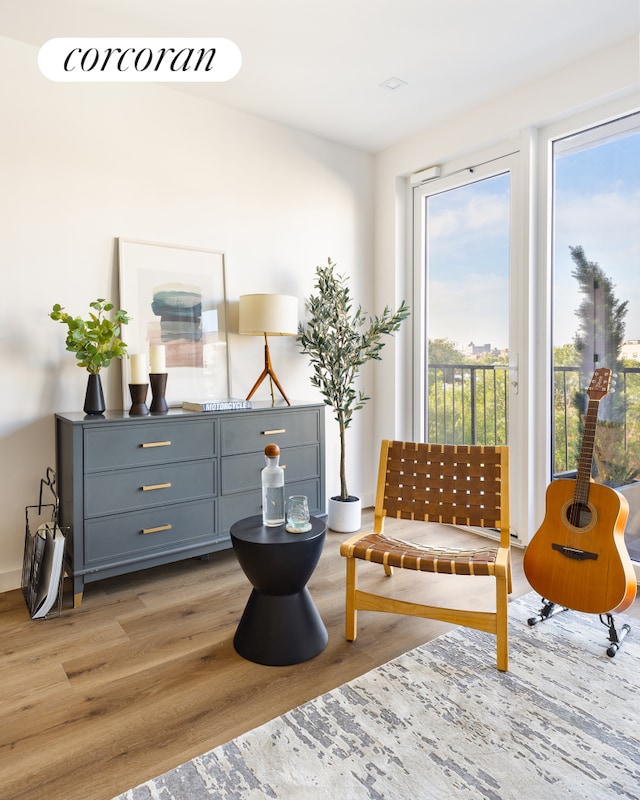 sitting room with healthy amount of natural light and light wood finished floors