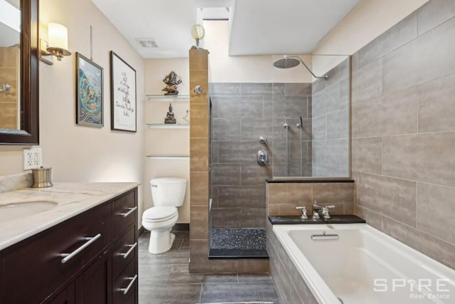 full bathroom featuring independent shower and bath, vanity, and toilet