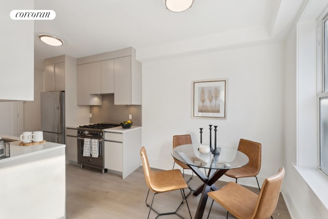 dining area featuring light wood-type flooring