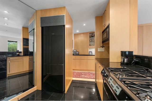 kitchen featuring dark countertops, recessed lighting, backsplash, and built in appliances