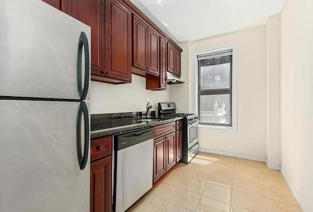 kitchen featuring light tile patterned floors, appliances with stainless steel finishes, plenty of natural light, and sink