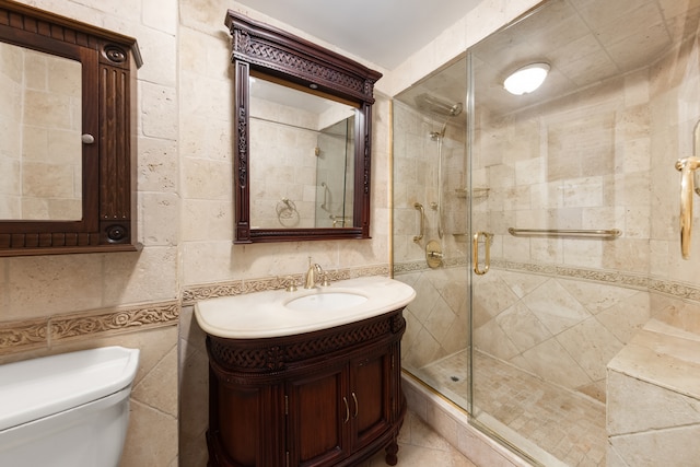 333 E 53rd St Unit 5Kl, New York City, NY 10022 - bathroom featuring tile walls, a stall shower, vanity, and toilet