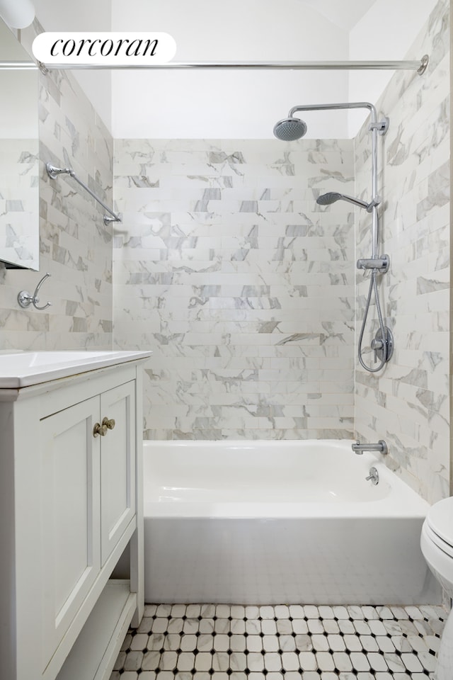 full bathroom with toilet, vanity, and  shower combination