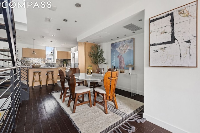 dining room featuring dark wood-type flooring