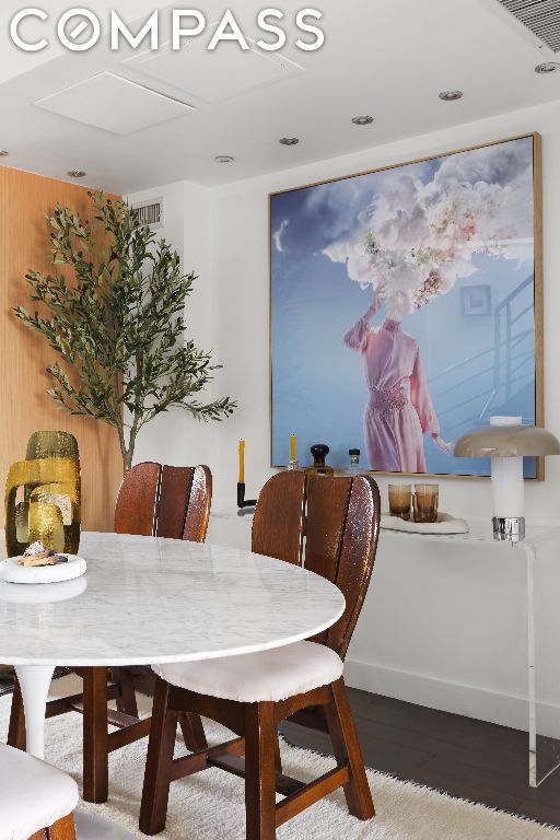 dining space with hardwood / wood-style floors