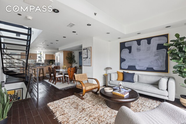 stairway with hardwood / wood-style floors