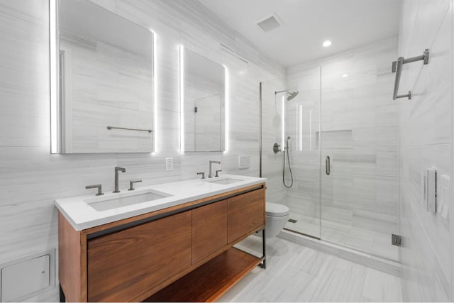 bathroom featuring walk in shower, vanity, tile walls, toilet, and tile patterned floors