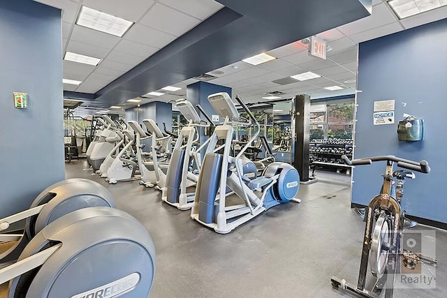 gym featuring a paneled ceiling