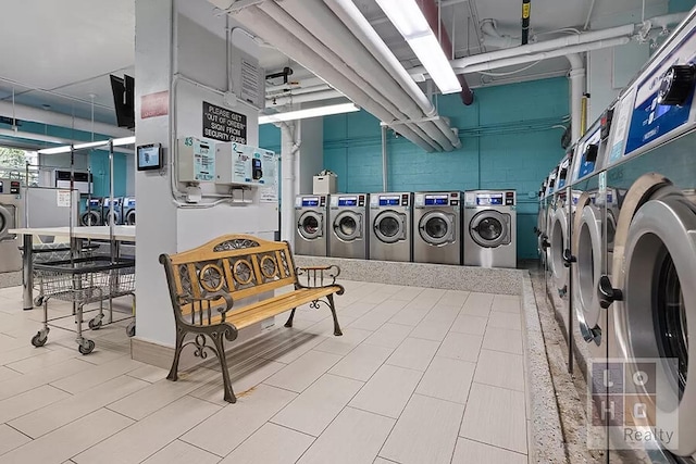 community laundry room with washing machine and clothes dryer