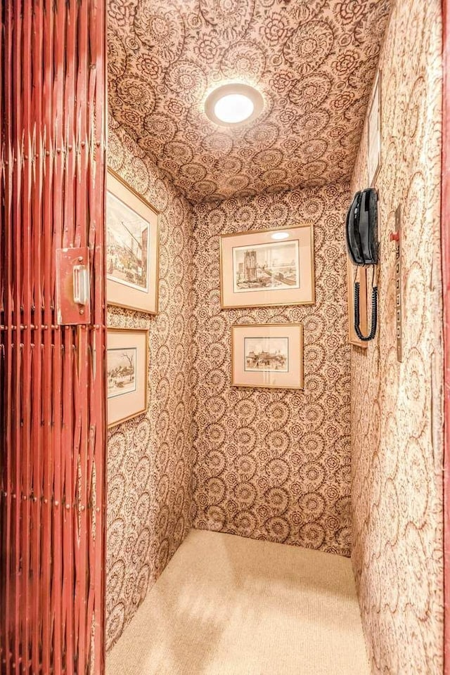 124 E 62nd St, New York City, NY 10065 - hallway featuring carpet and wallpapered walls