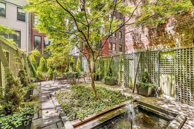 124 E 62nd St, New York City, NY 10065 - fenced backyard featuring a patio