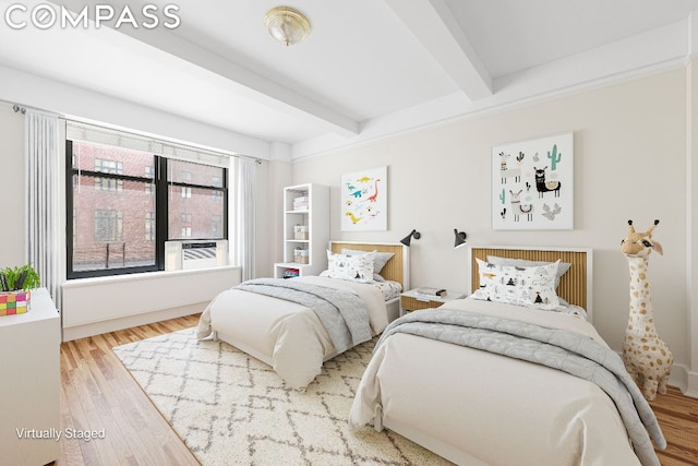 bedroom with hardwood / wood-style floors, beam ceiling, and cooling unit