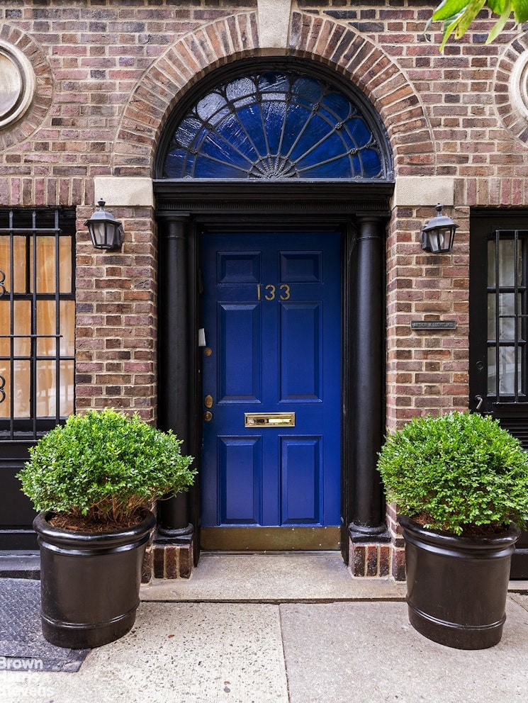 property entrance with brick siding