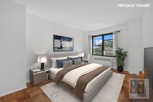 266 E Broadway Unit B606, New York City, NY 10002 - bedroom featuring radiator heating unit and baseboards