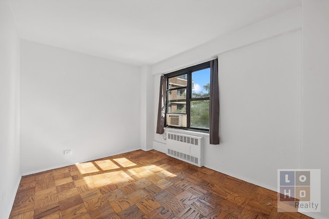 266 E Broadway Unit B606, New York City, NY 10002 - empty room featuring radiator heating unit and cooling unit