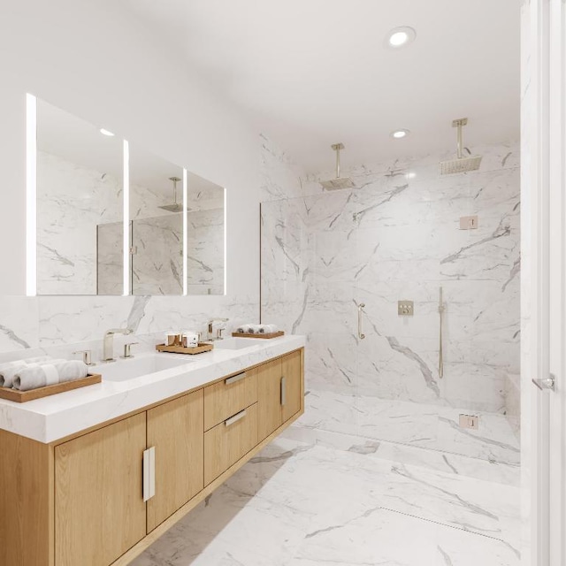 bathroom with walk in shower, vanity, and tile walls