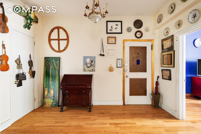 entrance foyer featuring light wood-style floors and baseboards