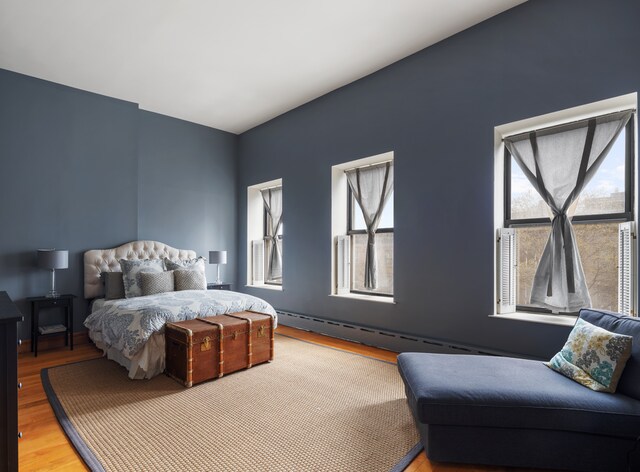 bedroom with wood finished floors