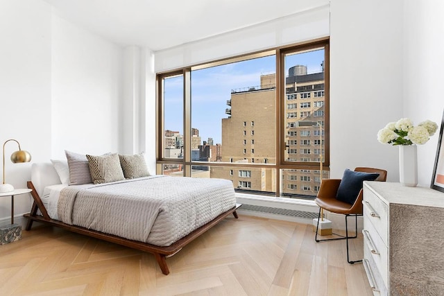 bedroom featuring light parquet flooring