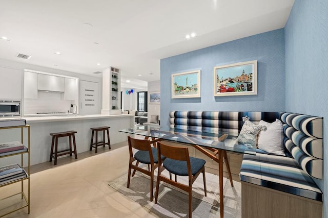 interior space featuring sink and light parquet floors