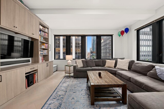 living room with beam ceiling