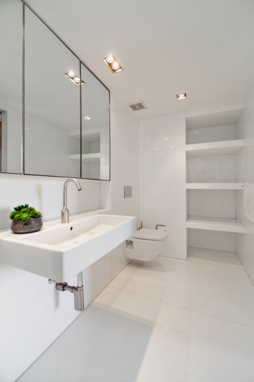 bathroom featuring tile patterned flooring, sink, and toilet