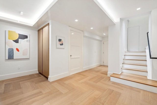 interior space with stairway, recessed lighting, and baseboards