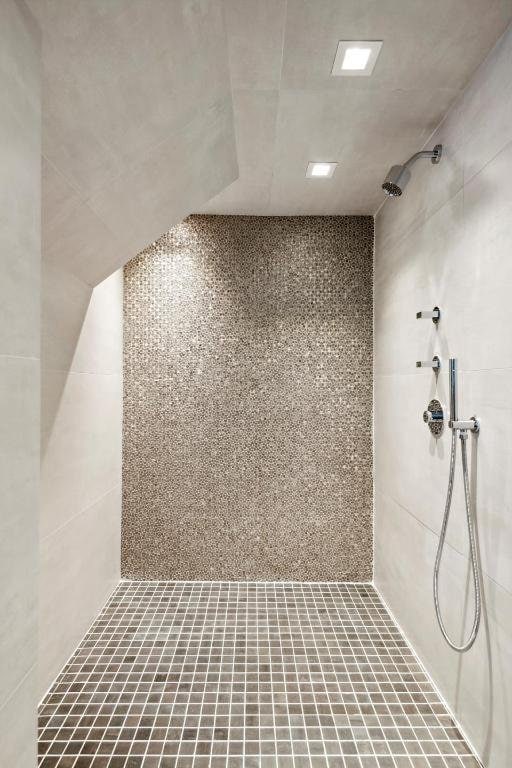 bathroom with tiled shower