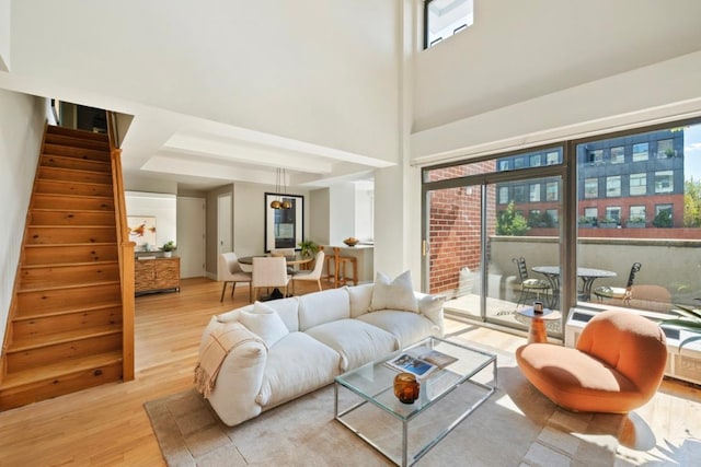 living room featuring a healthy amount of sunlight and light hardwood / wood-style flooring