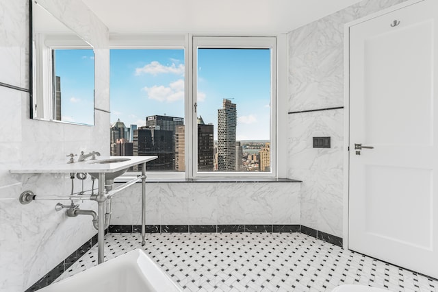 full bathroom with a city view