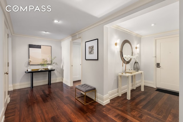 foyer featuring baseboards, dark wood-style flooring, and crown molding