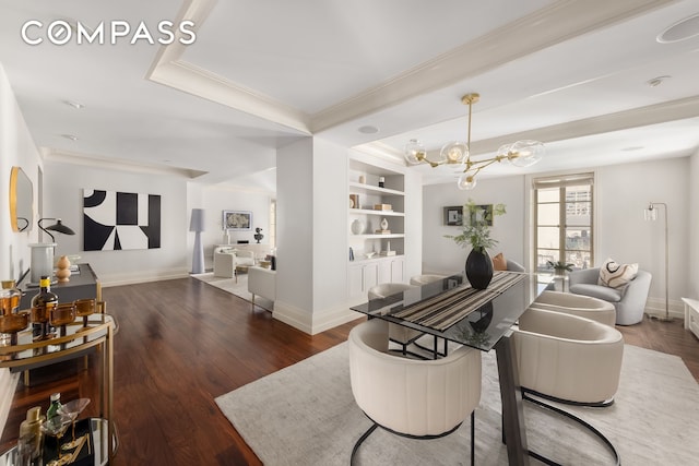 living room with an inviting chandelier, built in shelves, baseboards, and dark wood-type flooring