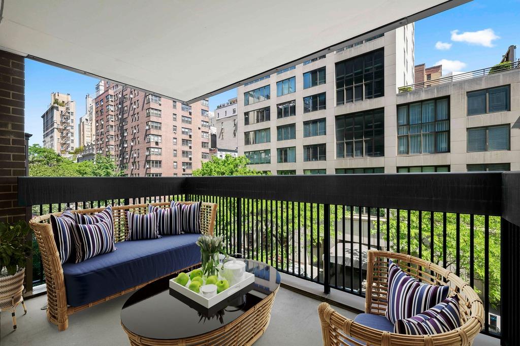 balcony featuring a view of city and outdoor lounge area