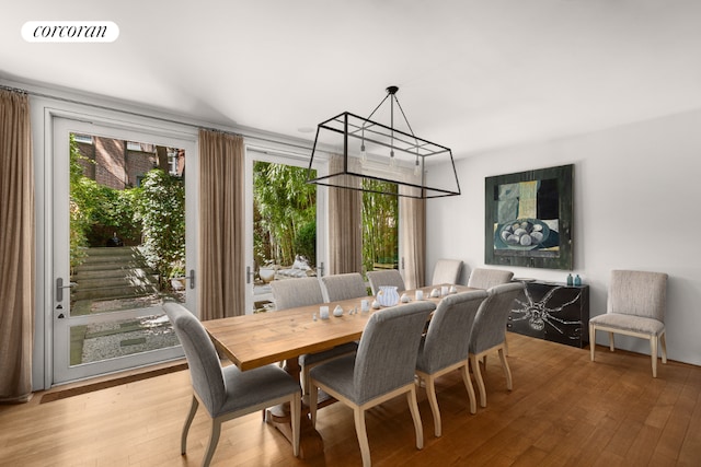 dining room with visible vents and hardwood / wood-style flooring