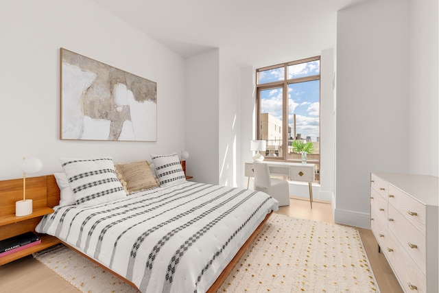 bedroom with light wood-type flooring