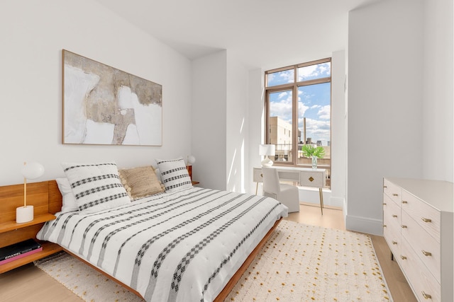 215 E 19th St Unit 7H, New York City, NY 10003 - bedroom with light wood-style floors