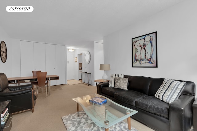 living room featuring visible vents and light colored carpet