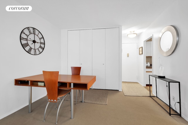 carpeted dining room with baseboards and visible vents