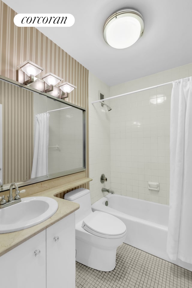 full bathroom featuring tile patterned flooring, wallpapered walls, toilet, shower / tub combo with curtain, and vanity